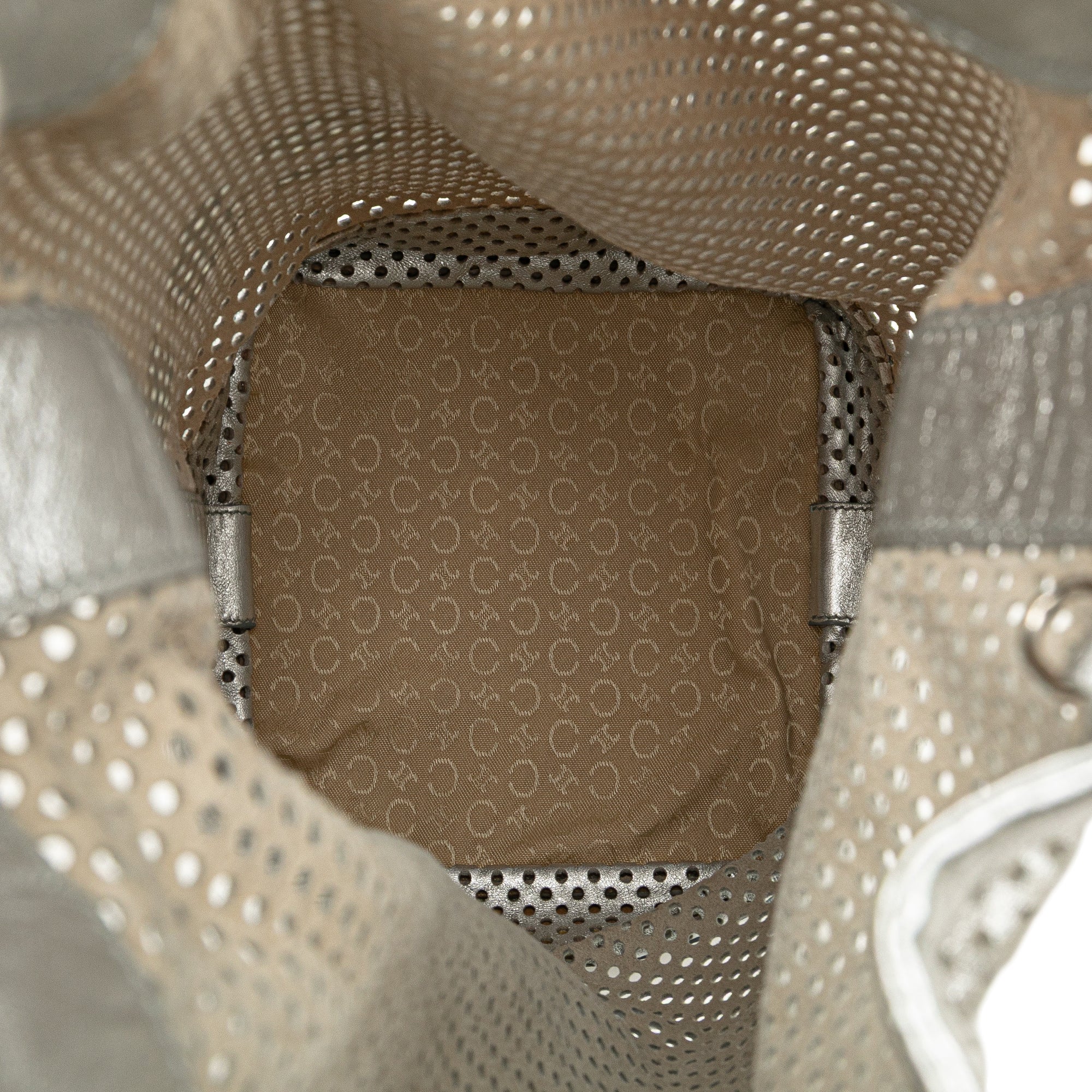 Perforated Metallic Calfskin Sling Backpack
