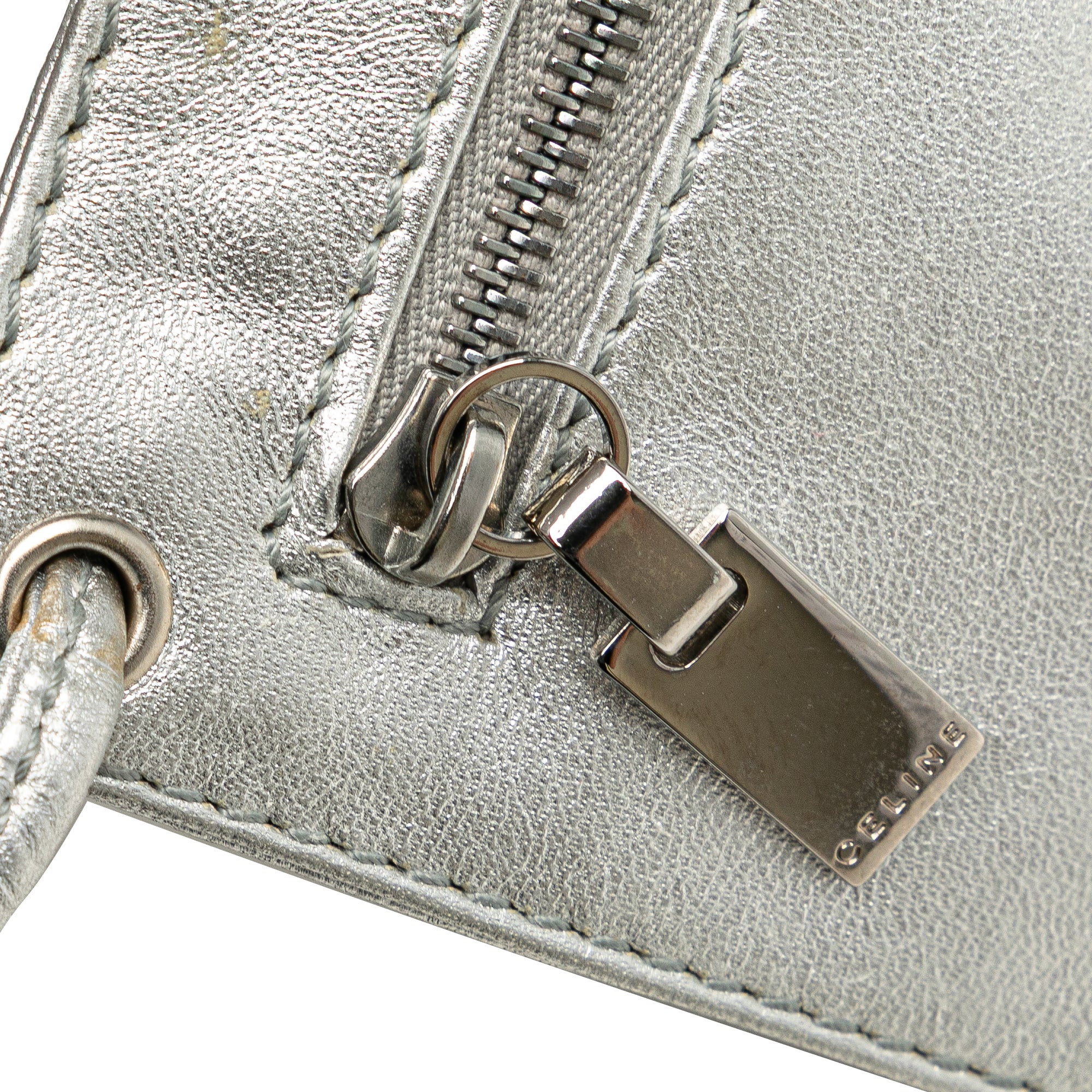 Perforated Metallic Calfskin Sling Backpack