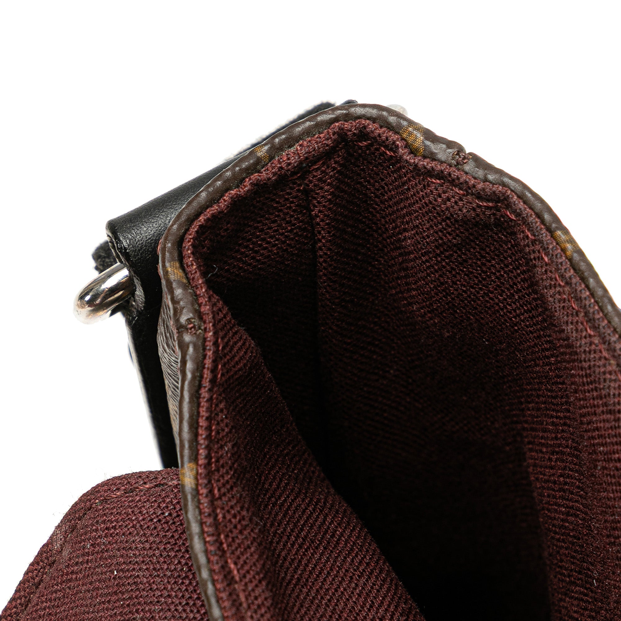 Monogram Macassar District PM