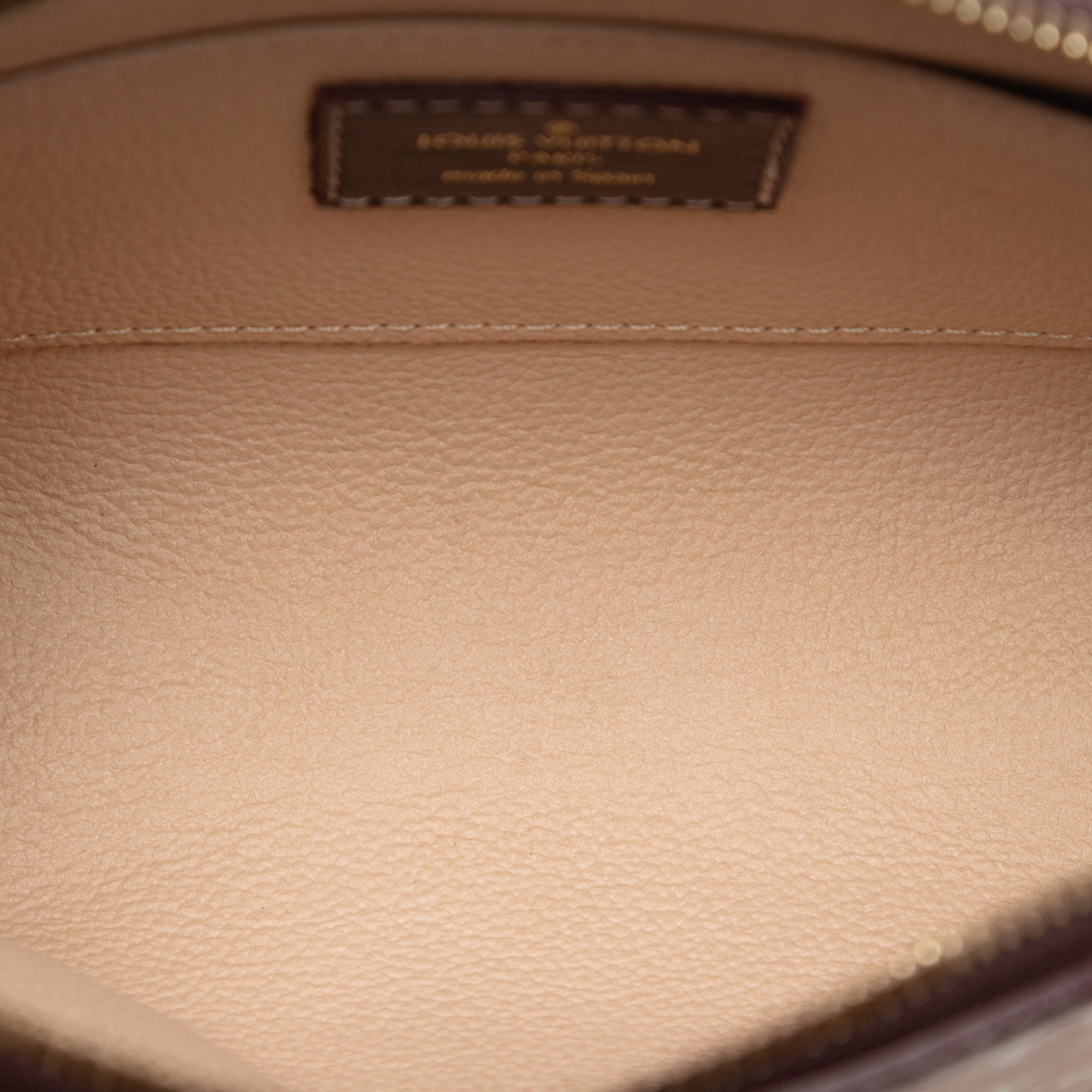 Monogram Mini Lin Cosmetic Pouch