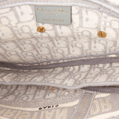 Oblique Canvas Embroidered Saddle Bag