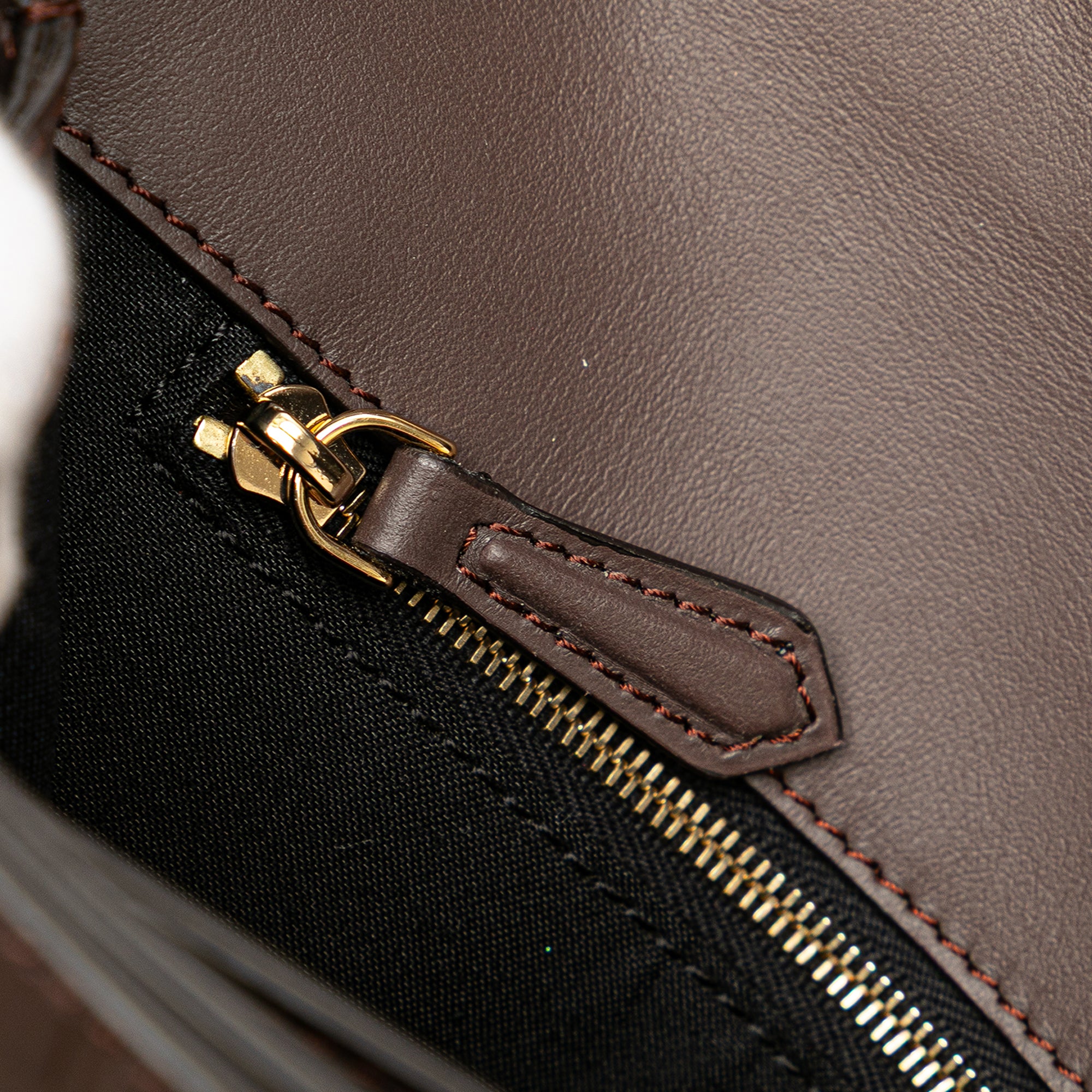 Zucca Embossed Leather Handle Clutch