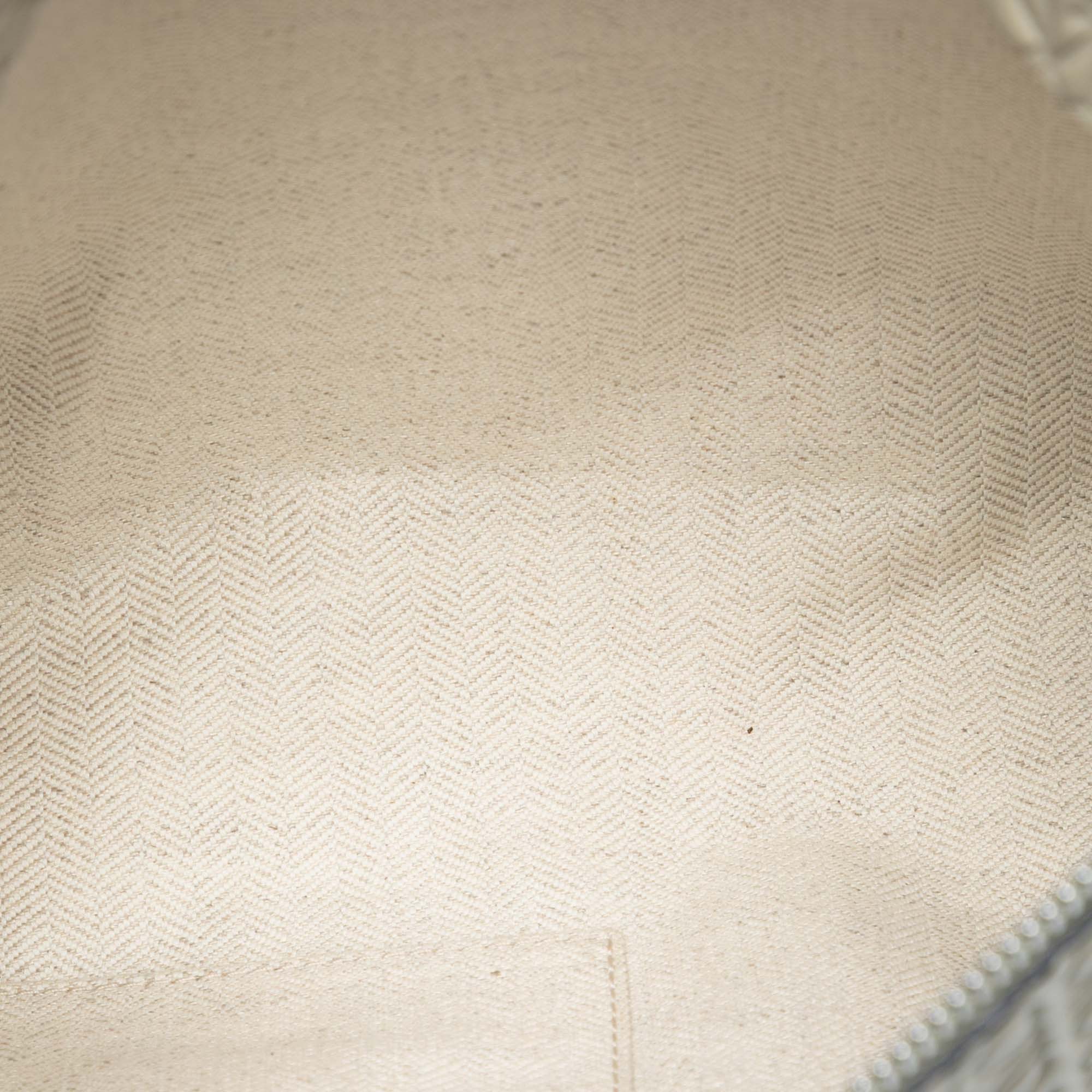 Embossed Leather Anagram Repeat T Clutch