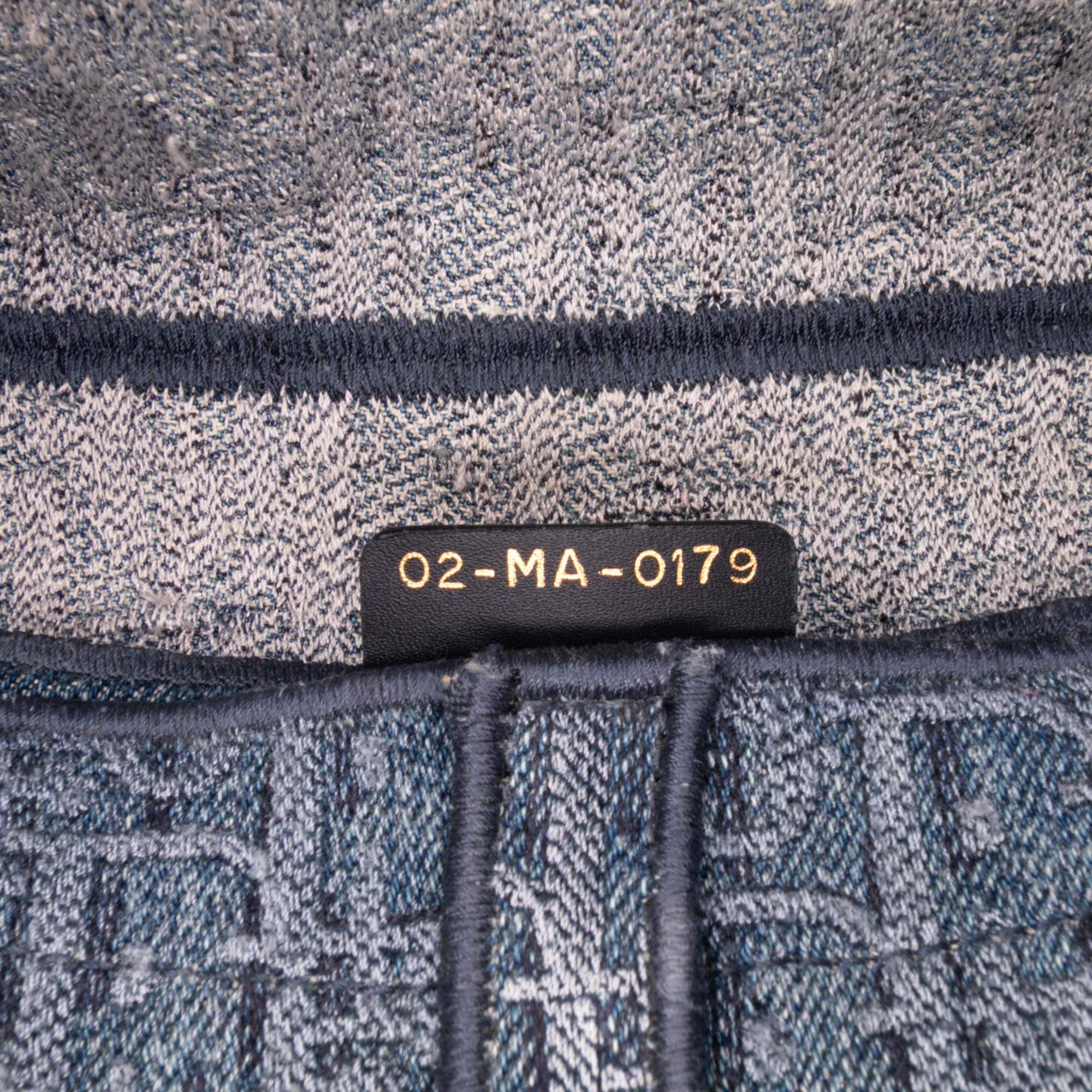 Oblique Embroidered Denim Saddle Bag