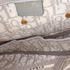 Oblique Canvas Embroidered Saddle Bag