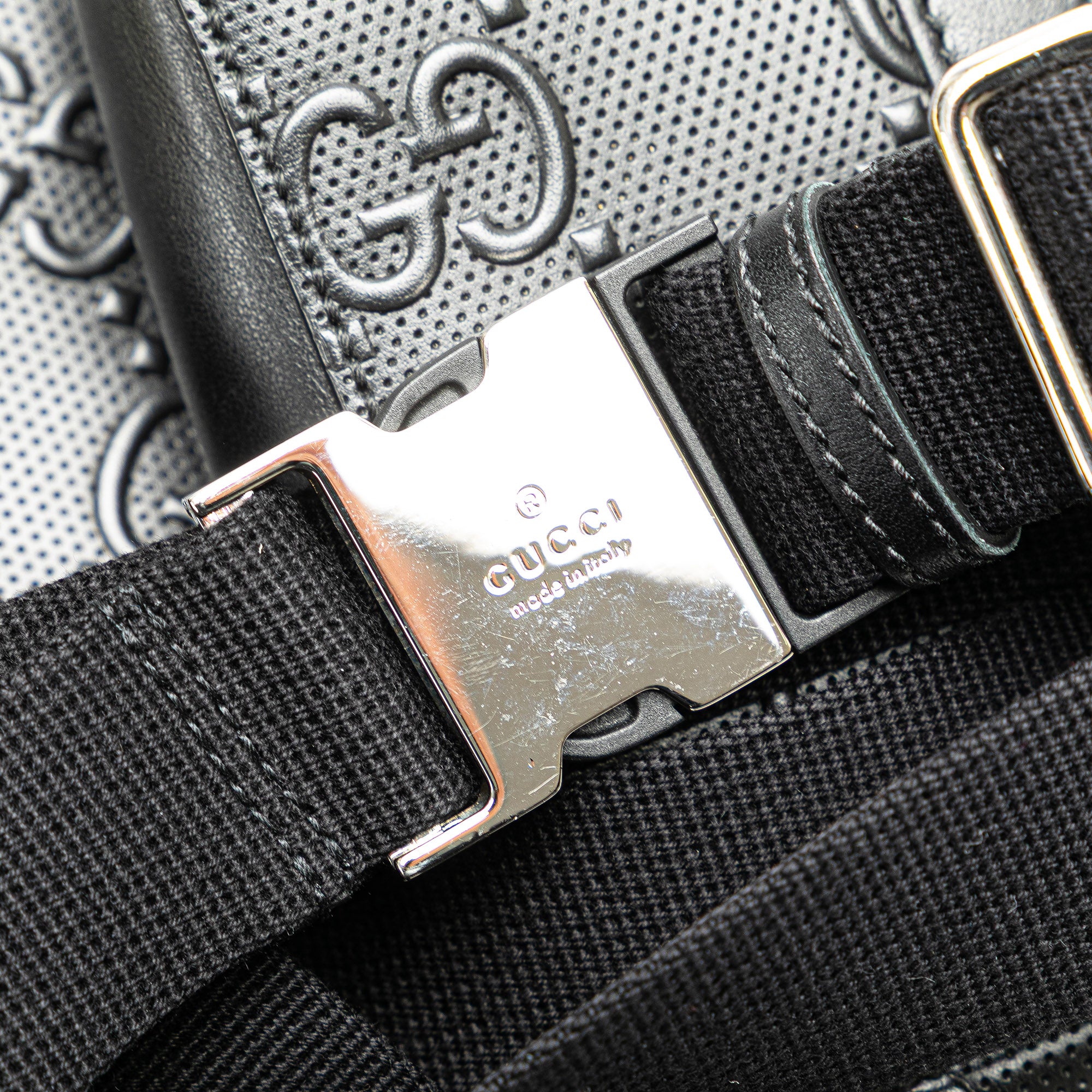 GG Embossed Perforated Double Belt Bag