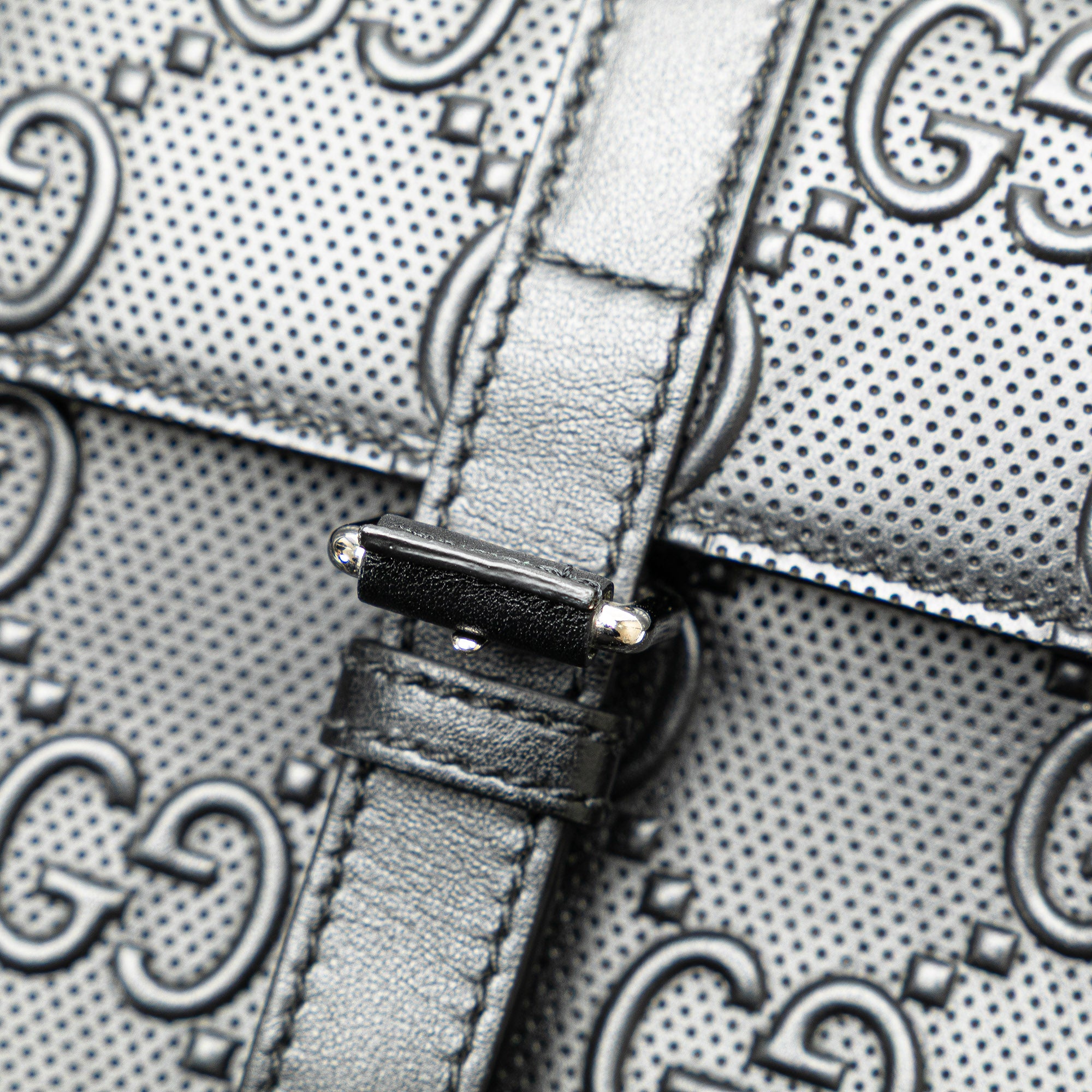 GG Embossed Perforated Double Belt Bag