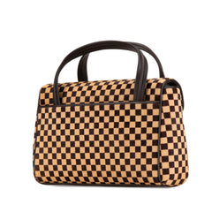 Damier Sauvage Lionne