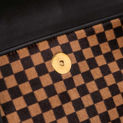 Damier Sauvage Lionne
