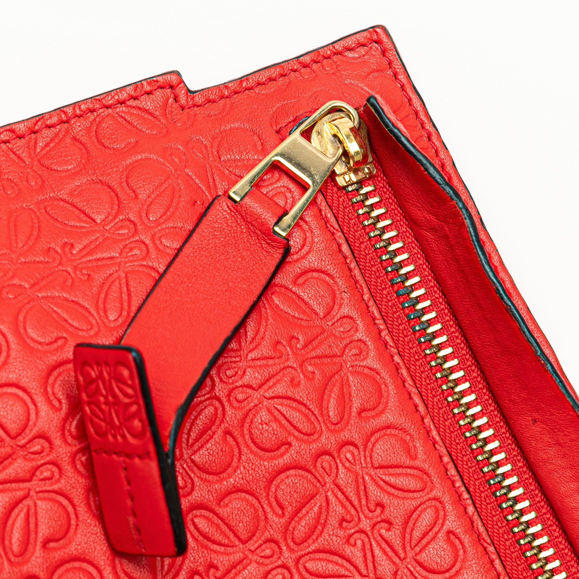 Embossed Anagram Repeat T Clutch