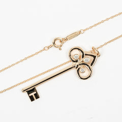 Tiffany & Co. Fleur de Lis Key Pendant Necklace 18K Pink gold and Diamonds